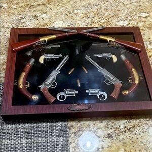 Decorative Gun Display Case with Silver and Gold Accents